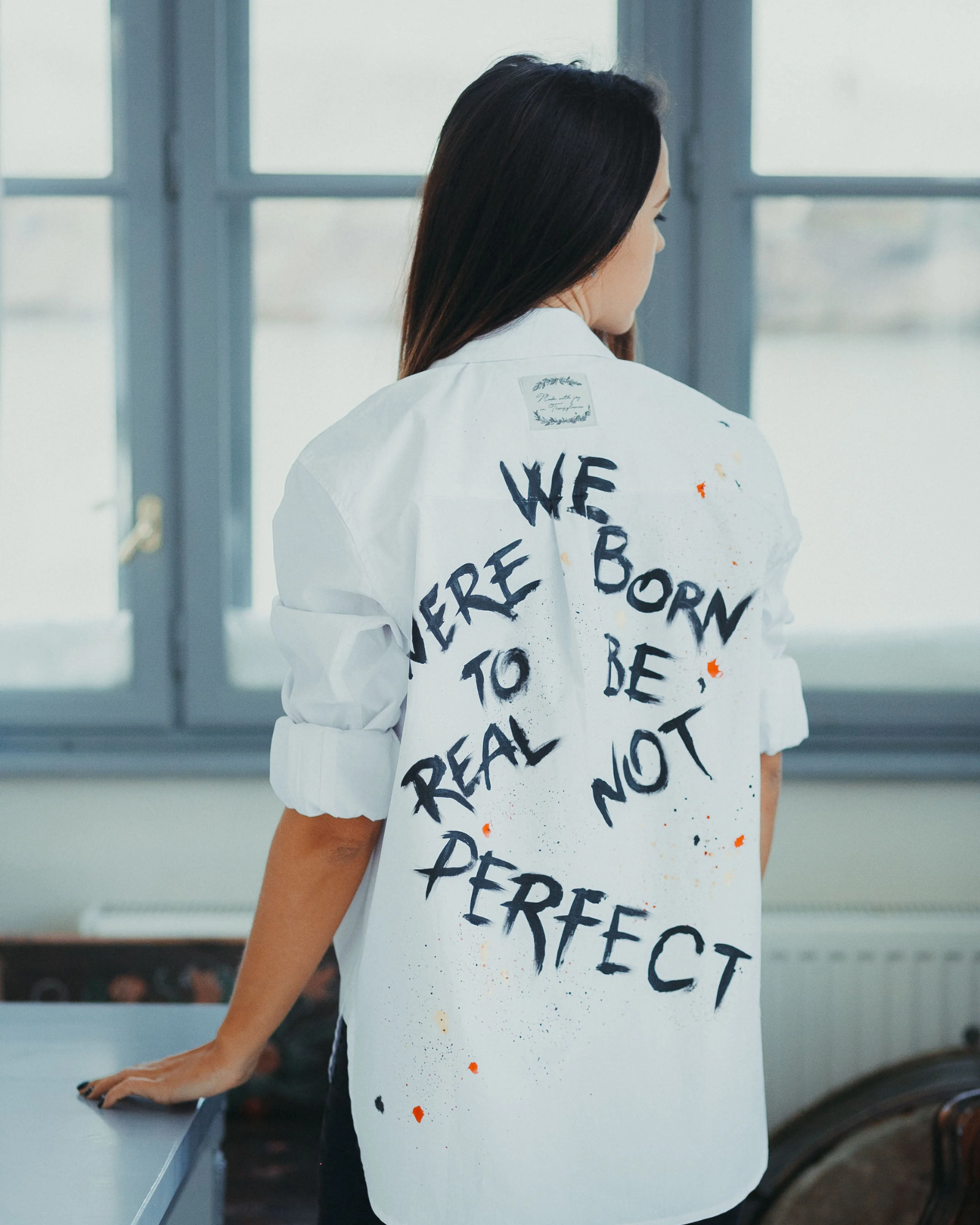 "We were born to be real" hand painted women's shirt